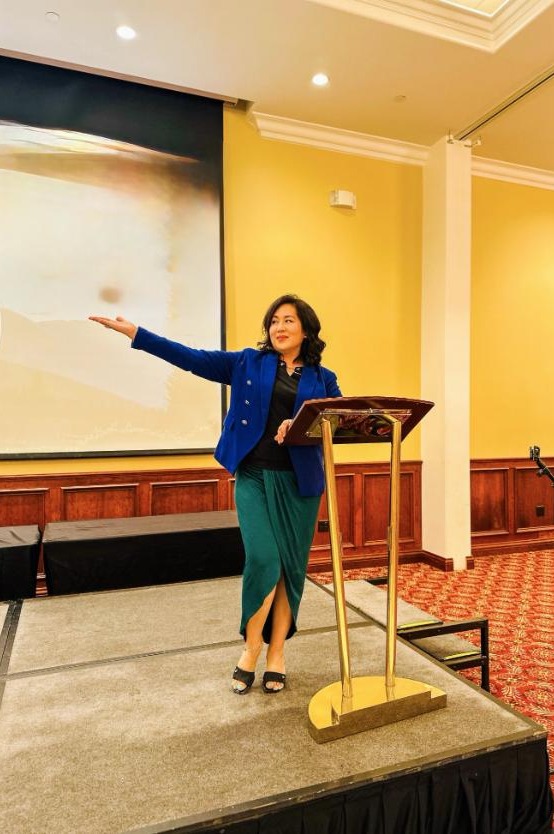 Socorro speaking on stage